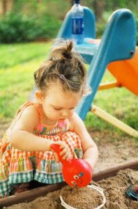 Child playing in sandbox